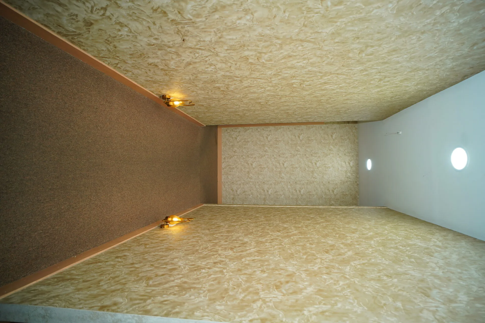 Softly lit corridor at The Zen Spa & Lounge, Guntur